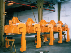 Coil tongs, coil tong, coil gripper, coil grab, telescope coil grab, horizontal coil tongs, tong for sheet coils, coil lifter, vertical coilgrab, parallelogram coilgrab, parallelogram coiltongs, Coil Lifting & Handling Equipment, LOAD HANDLING DEVICES